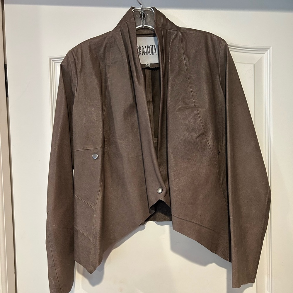 Faux leather jacket with cowl neck opening.